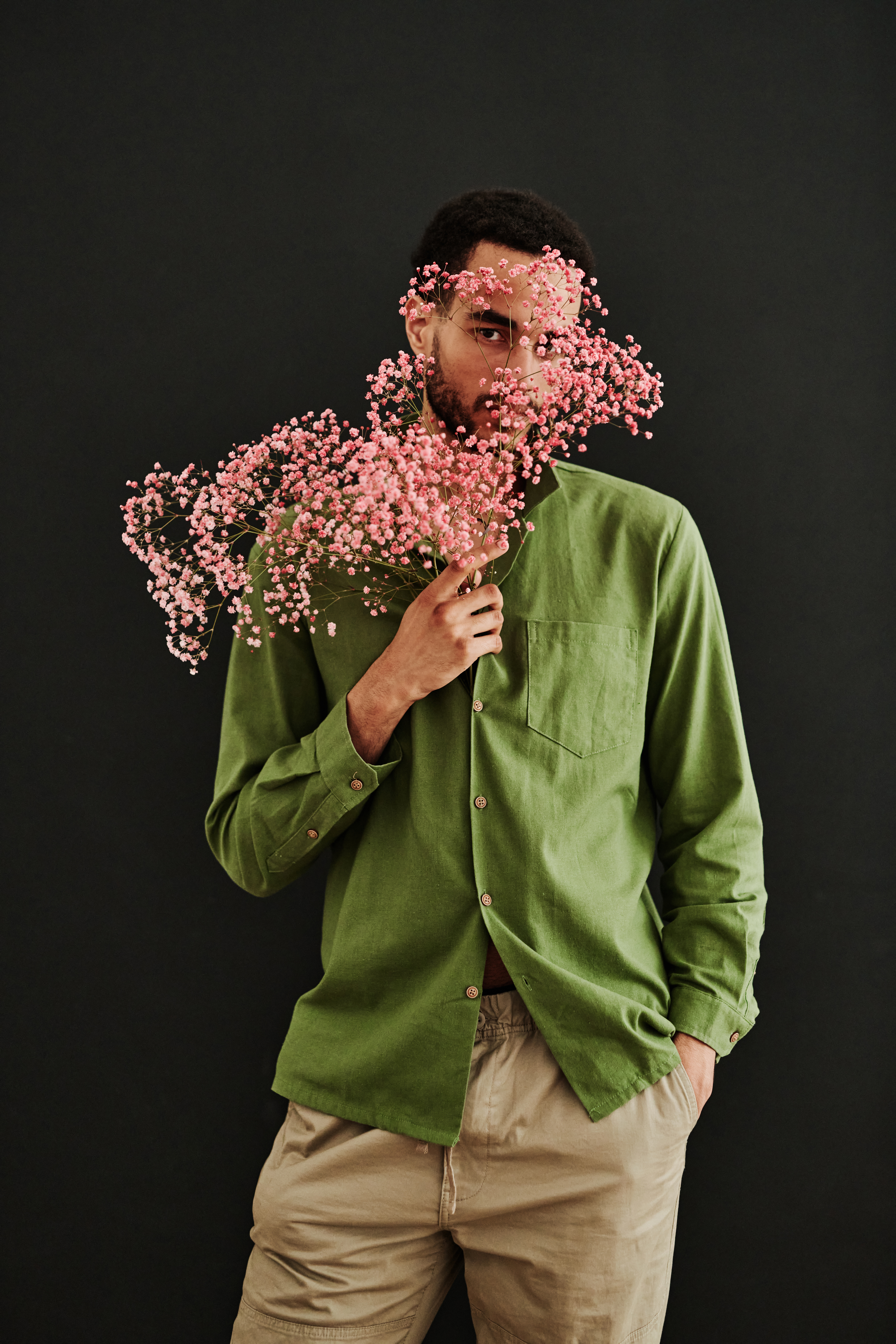 Fashion model posing with dry flowers